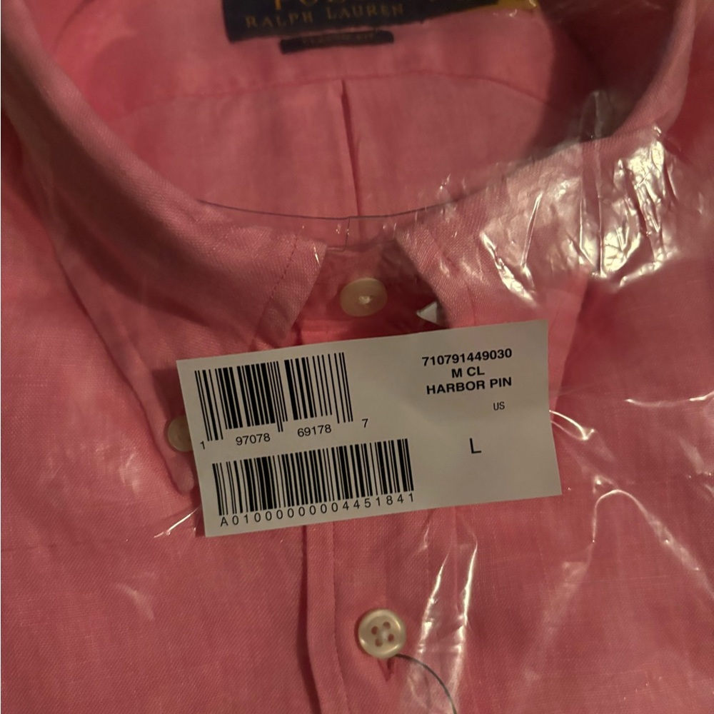 pink men’s polo. Never worn still in the plastic and original box it came in. - Picture 4 of 5